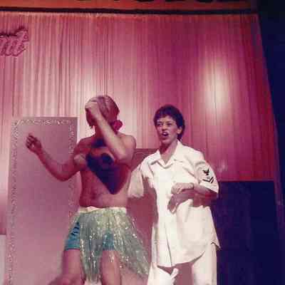 A color photograph of Sharon dancing with one of the other dancers.