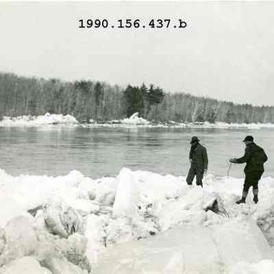 Two Men Setting Charges to Blast Ice Chunks