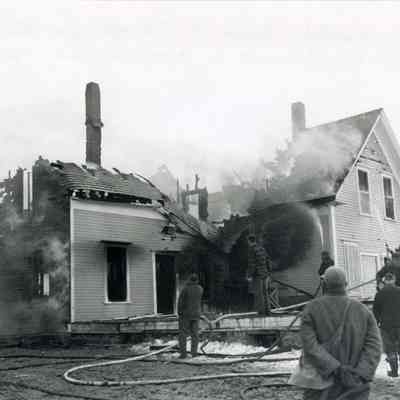 A photo of a house destroyed by fire. 3/23/1955