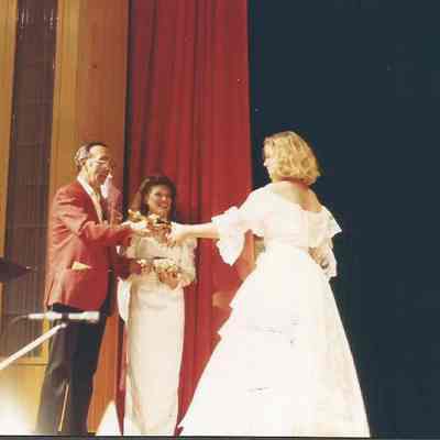 Gene Gagne presenting a participant trophy to Darby Labbe