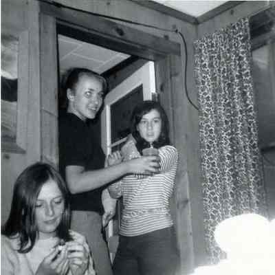 A B/W photograph of some young people parting.