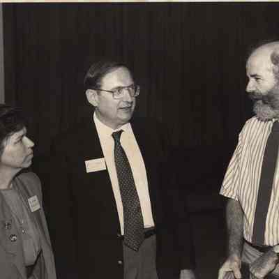 A photo view of three people. 9/25/1992.