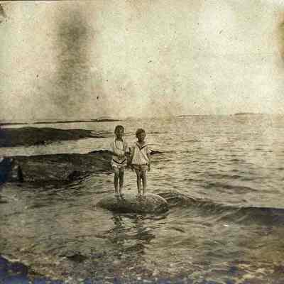 Two boys playing in the ocean