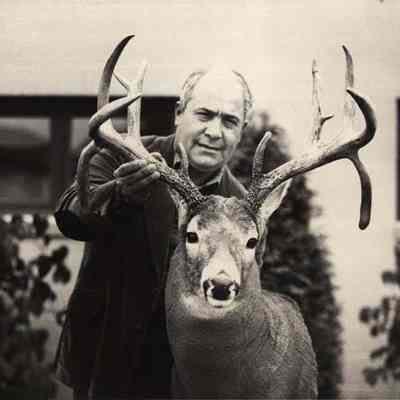 A photo view of a man with a deer head. 10/23/1992