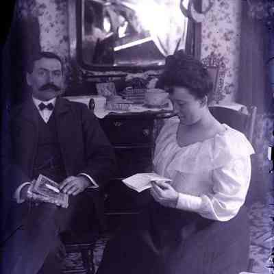 A couple sitting in a living room.