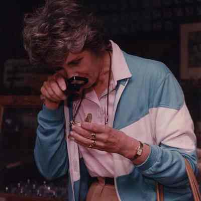 A photo view of a lady checking out an antique watch. 6/19/1989.