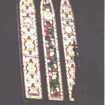 A photo of stained glass windows at the First Parish Church.