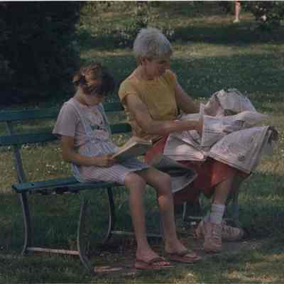 A photo view of two people on a bench. 6/23/1988.