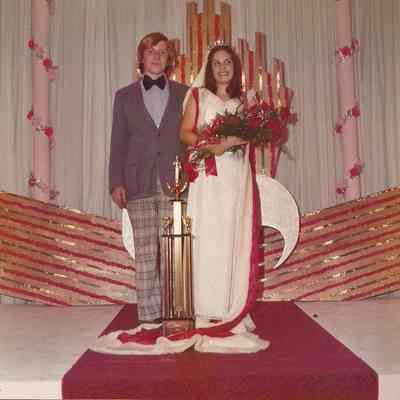 The 1974-75 Teen Queen Debbie Jellison crowning the 1975-76 Teen Queen Phyllis
