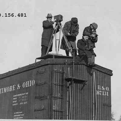 Group of Photographers on a Railroad Car
