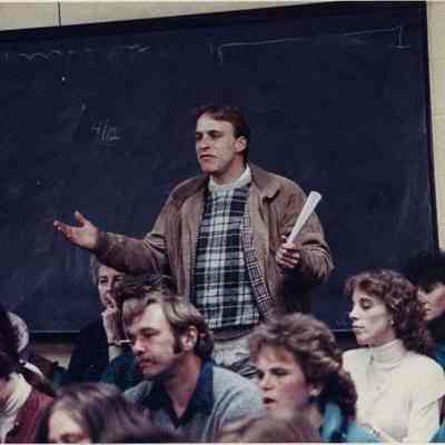 A photo view of a man speaking at the West Harpswell School.