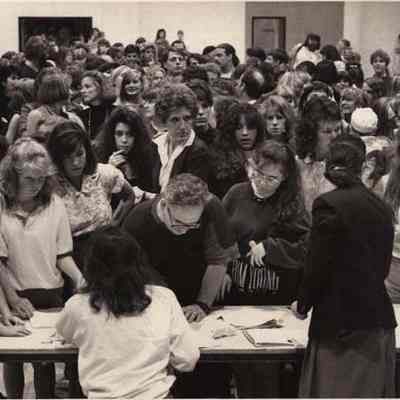 A photo view of students signing up for movie tryouts.