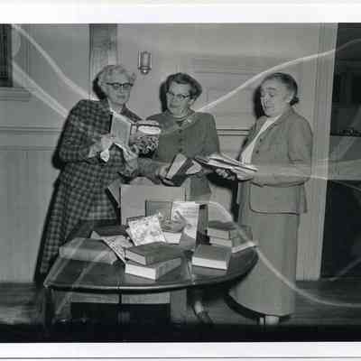 Women Examine Book Donations