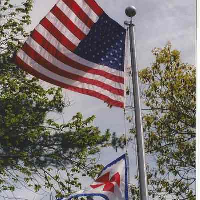 The American Flag and a Maltese Cross Banner