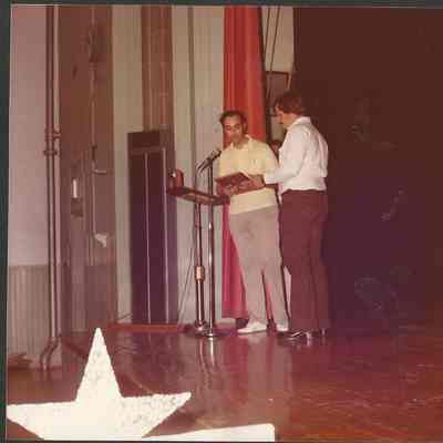 Gene Gagne pageant director presenting the pageant award to Kenneth Fortin