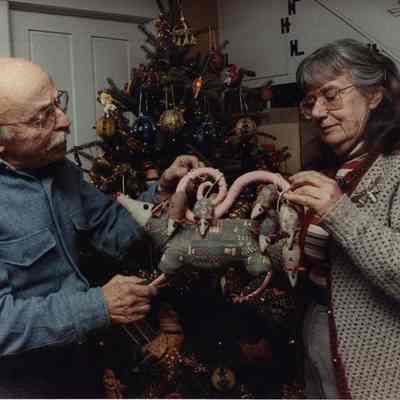 A photo view of a couple making Christmas decorations.