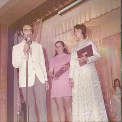 Gene Gagne reading the Pageant Award to the audience