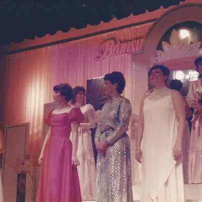 A color photograph of 3 Teen Queens.