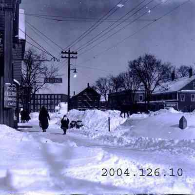 Maine Street , Brunswick with lots of snow piled about.