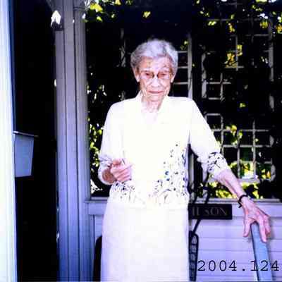 Photo of Elizabeth Wilson standing on her porch.