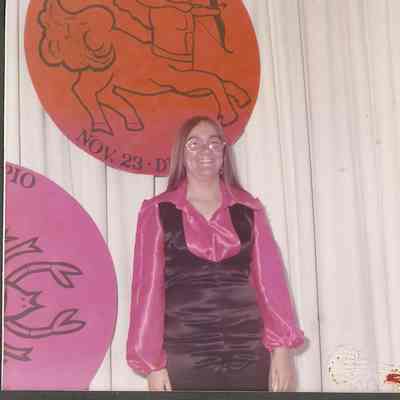 Contestant #1 Diane Racine is pictured with her Zodiac sign Capricorn.