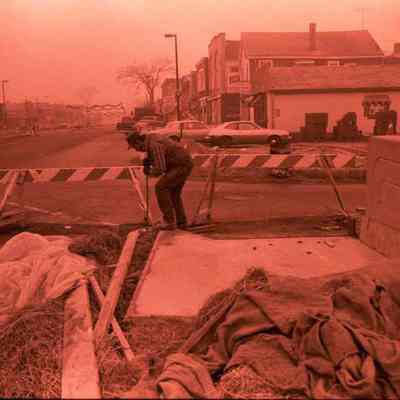 A photo view of sidewalk work being done. 11/28/1984.