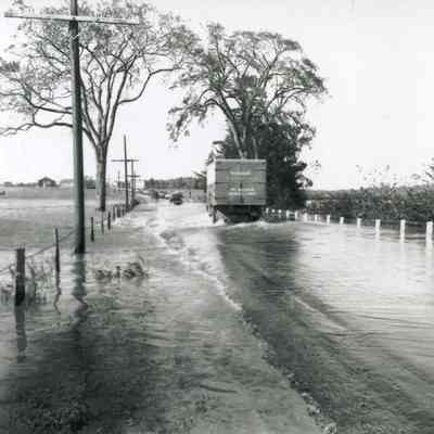 A photo of Route 201 during Hurricane Edna. 9/12/1954.
