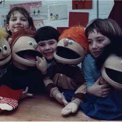 A photo view of children playing. 3/27/1990.