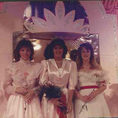 A color photograph of 1985 Miss Brunswick Patricia Stuart with her court.