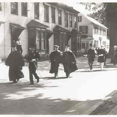 People in Graduation Gowns Marching in Brunswick's 200th Anniversary Parade