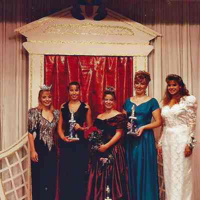 A color photograph of 5 girls who are all winners