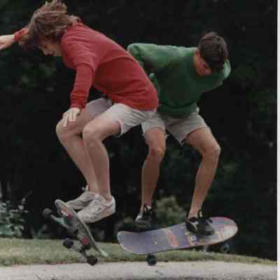 A photo view of 2 children skate boarding. 7/7/1989.