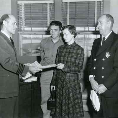 Three People Receiving an Award