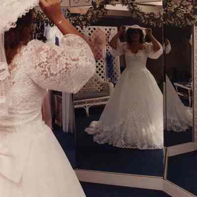 A photo view of a girl in a wedding dress. 7/24/1989.