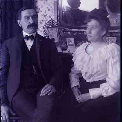 Alfred LeTarte sitting in a living room.