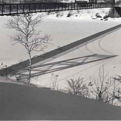 Shadow of the Swinging Bridge on the Ice