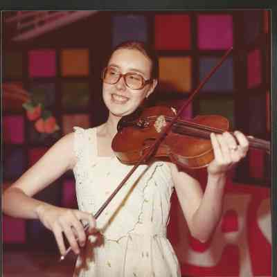 Contestant #4 Marianne Racine playing her violin.
