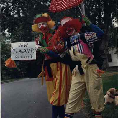 A photo view of two clowns hitch hiking. 7/5/1988.