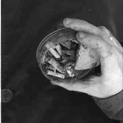 A negative photo view of items found at the archeological dig. 5/1979.