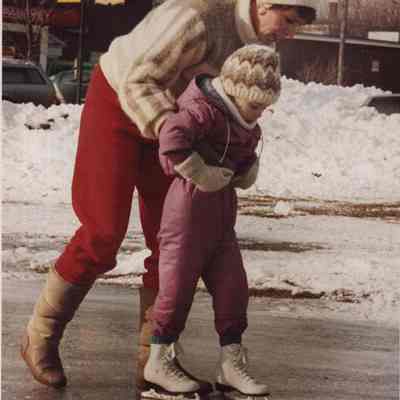 A photo view of a child learning to skate. 1/12/1987.