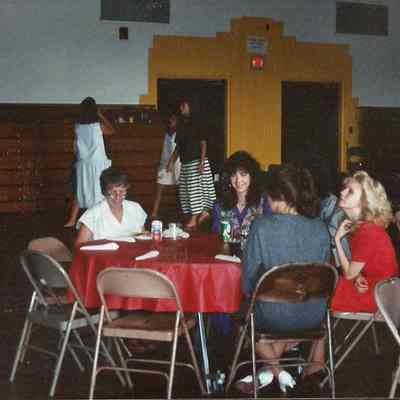 June Burke sitting with Heather May. Michelle Bergquist and Jodie McKenna.