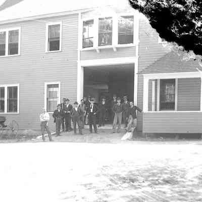 Unknown Men Standing in front of a Building