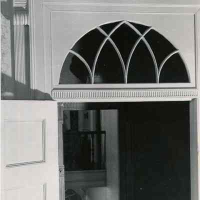 A photo of the glass over an interior door at the Porter House.