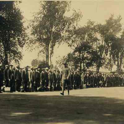 A photo of men lined up waiting for the train. WW I