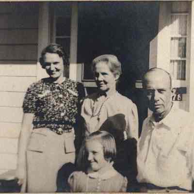 Family Standing on their Porch
