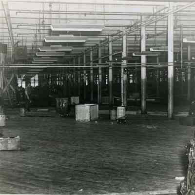 Workmen Putting Down a New Floor in the Weave Room