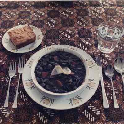 A photo view of a table setting of food. 4/10/1989.