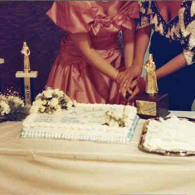 Darby Labbe and Katherine Albano cutting the cake