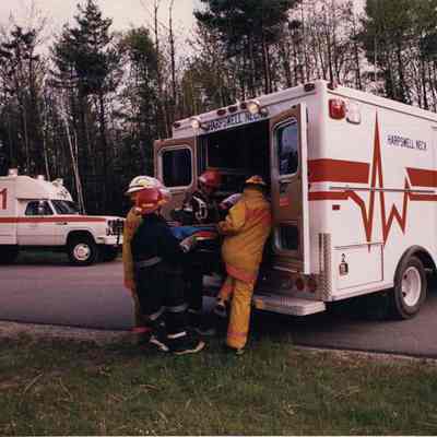 A photo view of EMT's at work. 6/29/1990.
