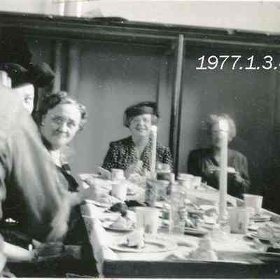 Group of People Sitting Around a Table